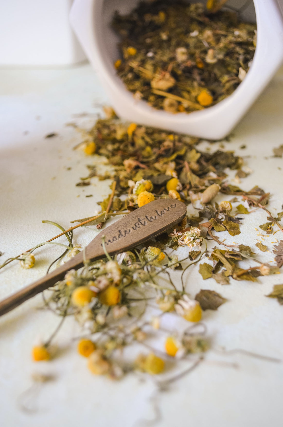 scattered chamomile flowers on the table